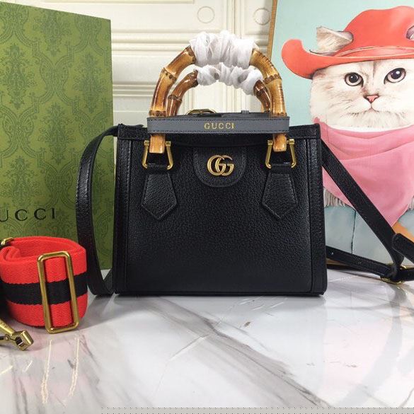G*u*i top handle bags